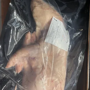 a chicken wrapped in plastic