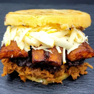 a sandwich with meat and cheese