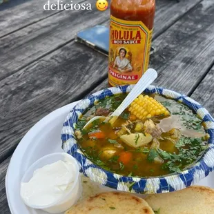 a bowl of soup and some bread