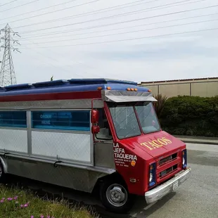 a taco truck parked on the side of the road