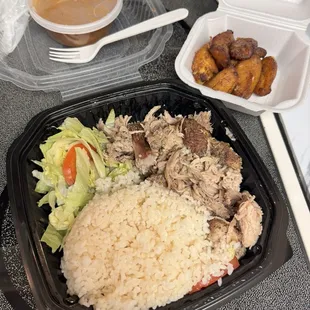 Pernil (roast shredded pork), fried sweet plantain, white rice, beans, small salad