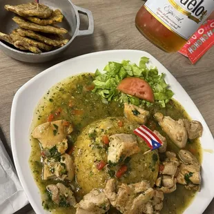 Mofongo Relleno in garlic sauce an added side of Maduros and a Modelo