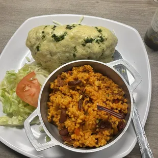 La Jibara - bacon wrapped chicken breast stuffed with mofongo topped with cream sauce and a side of mampostaeo.