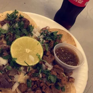 Dos tacos de Carne Asada y Lengua con una Coca fria.  So delicious!