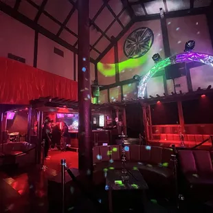 a bar with a clock on the wall