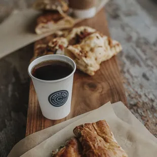 a cup of coffee and pastries