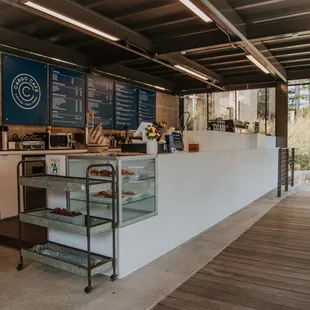 a counter with a display of pastries