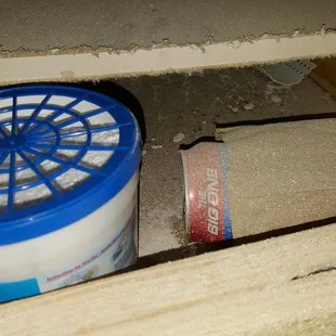 Empty beer can behind the AC filter