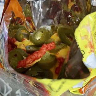 Hot Cheetos with nacho cheese and jalapeños is a good snack- on- the- go