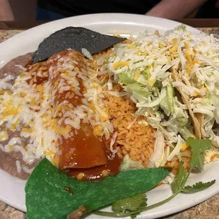 Beef enchilada and 2 beef tacos