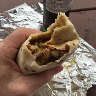 Spicy carne asada burrito with eggs and potatoes. Washed down with a Mexican Coke.