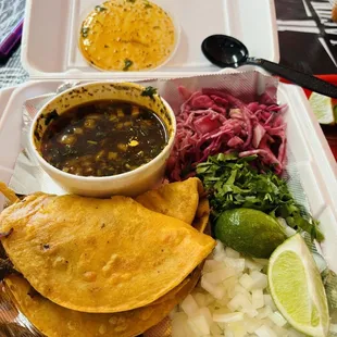 Quesabirria tacos x 3. Served with a mix of red cabbage and pickled onions, white onion and cilantro! Que Rico!