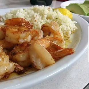 Camarones a la mantequilla (shrimp sauteed in butter). The camarones plates include rice, beans, and green salad. Yum!