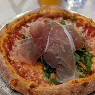 The Rocket pizza with prosciutto, arugula, fontina, lemon zest, and spicy evoo. YUM!