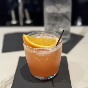 a drink with a slice of orange