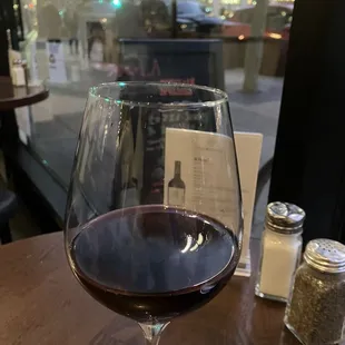 Enjoying my wine and the park lights outside