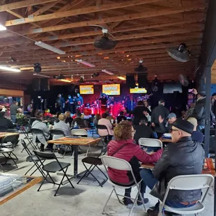 a group of people sitting at tables
