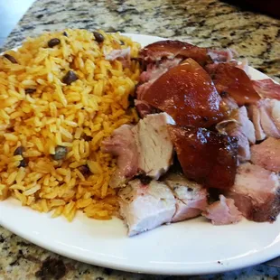 Pernil (shoulder or leg of the pig) and yellow rice