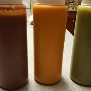 three bottles of ketchup