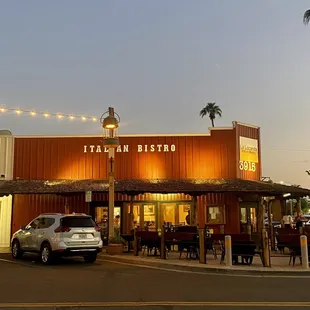 a car parked in front of a restaurant