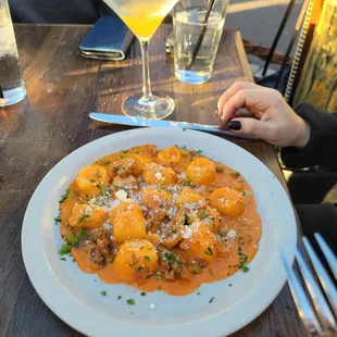 Gnocchi - Homemade gnocchi, prosciutto, mushrooms, peas, tomato cream sauce. The best gnocchi I&apos;ve ever had.