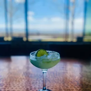 a green drink in a glass