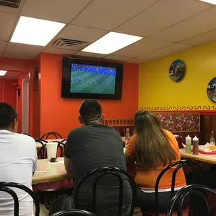 a group of people sitting at a table