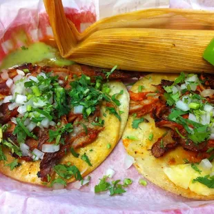 Tacos al pastor and chicken tamale.