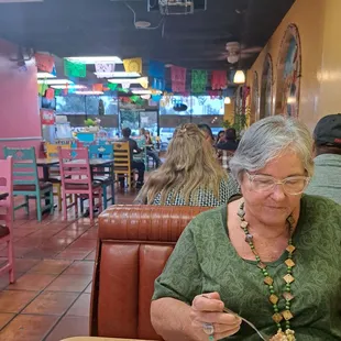 My wife at our table