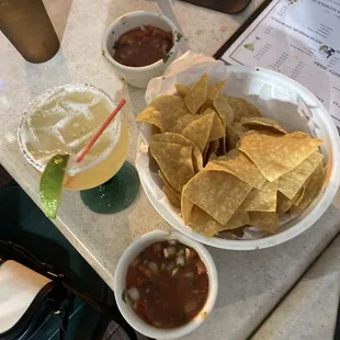 nachos, chips, and a drink