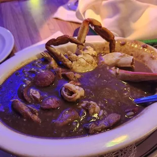 a bowl of soup with shrimp and shrimp