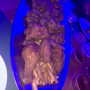 a platter of fried chicken and french fries