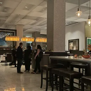 Lovely dining area with high ceilings but not too high ceilings and nice warm lighting