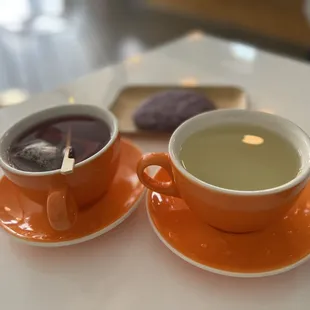 two cups of tea and a cookie