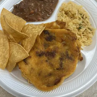 Shredded beef Papusa, chicken papusa, rice and beans with tortilla chips made fresh daily.