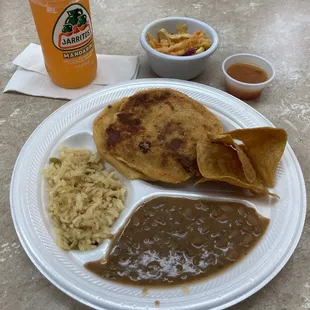 Pupusas with rice and beans.
