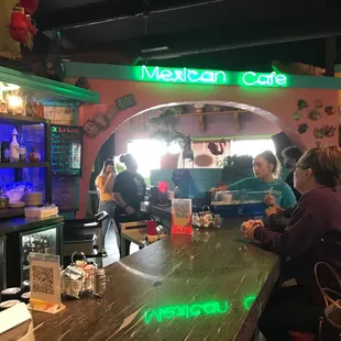 people sitting at the bar