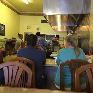 a group of people in a restaurant