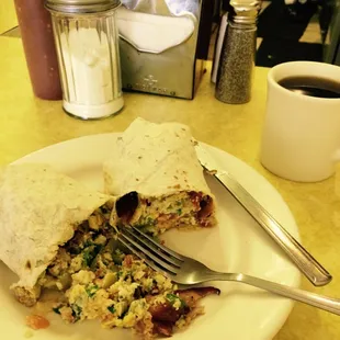 a burrito and a cup of coffee