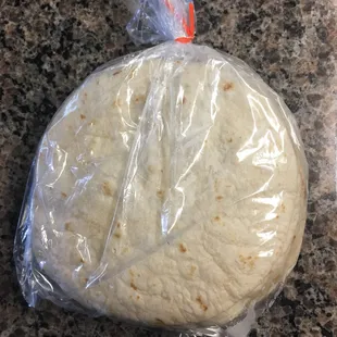 a tortilla wrapped in plastic