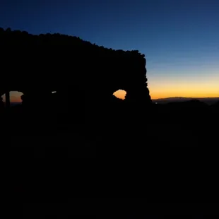 Sunset next a little house