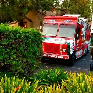 a red truck parked in a parking lot