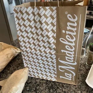 a brown paper bag with a welcome sign on it