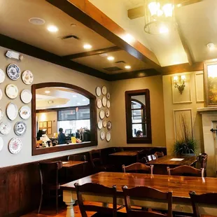 a dining room with a lot of plates on the wall