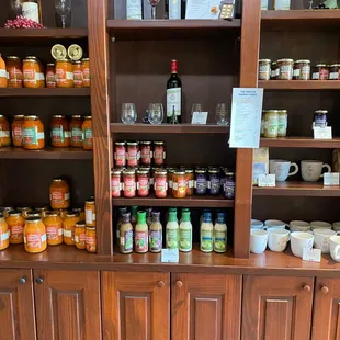 a display of jars of jams and condiments