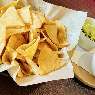 Fresh chips , guacamole and queso
