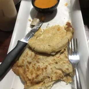 a plate of quesadillas and a bowl of soup