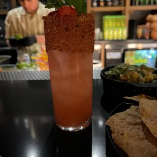 a drink with a garnish on the rim