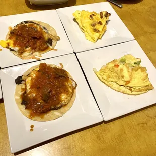 Huevos ranchero on the left. Tortilla con chorizo and Torilla con Vegetales on the right