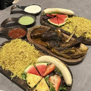 Lamb shank, goat shoulder, rice and fruit